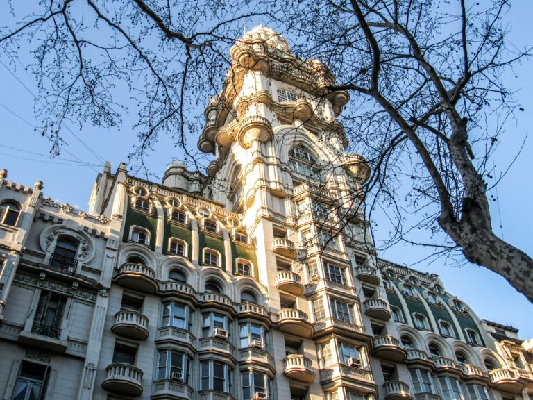 a tall building with a clock on the top of it